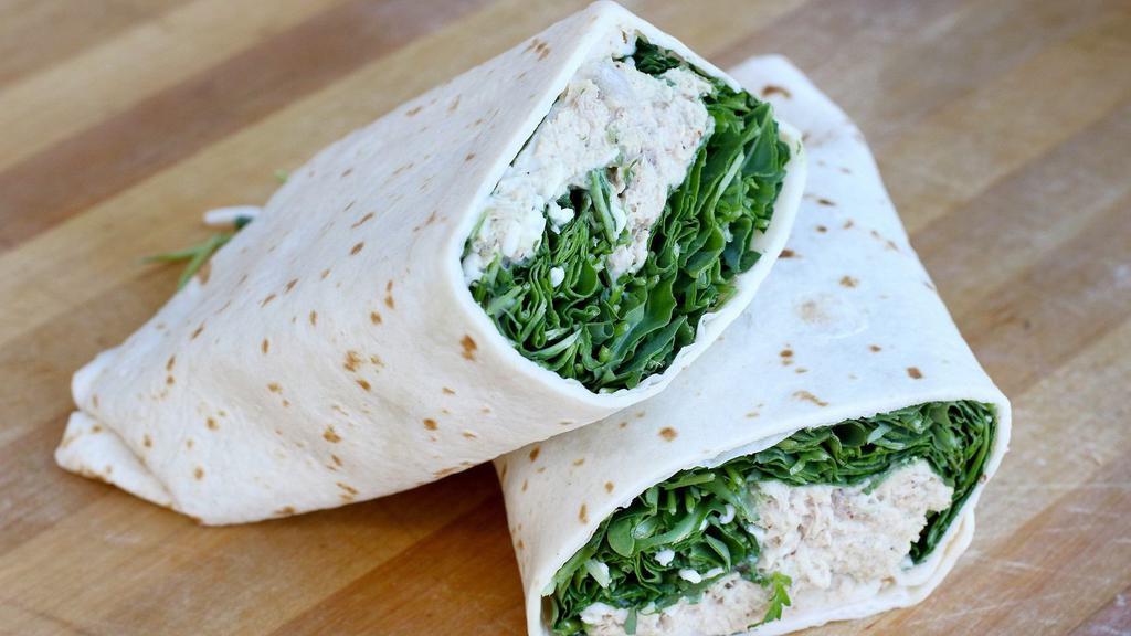 Tuna Wrap · Tuna salad made with tuna, mayo, celery, red onions, whole grain mustard, salt, and pepper. In a flour tortilla with asiago cheese and wild arugula.