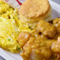 Susan's Special · 2 scrambled eggs delicately mixed w/cheese & onions served w/smothered potatoes in gravy & a...