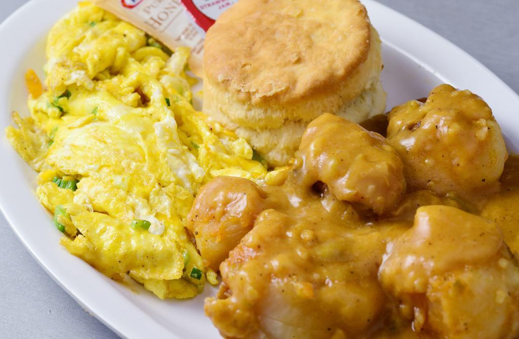 Susan's Special · 2 scrambled eggs delicately mixed w/cheese & onions served w/smothered potatoes in gravy & a hot fluffy biscuit.