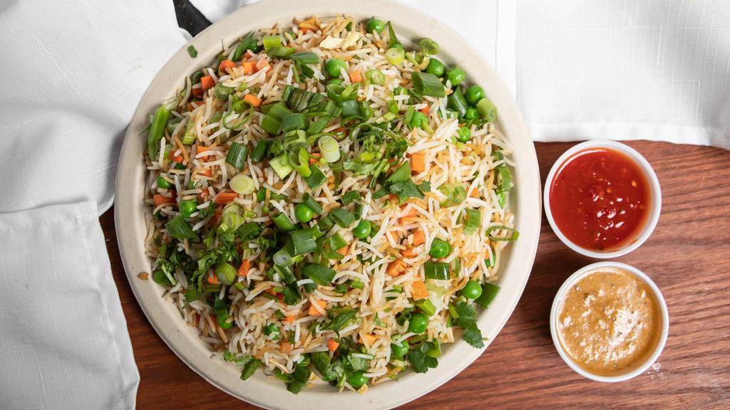 Veg Fried Rice · Steam-cooked rice, carrots, cabbage, green beans, asparagus, onion, garlic, msg tossed in vegetable oil and seasoned with black pepper, soy sauce, and salt.
