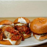 Meatball Sliders · Roll with meatball, basil, sauce, and Parmesan cheese.