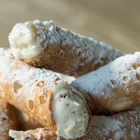 Cannoli · Italian pastries , filled with a sweet cream and chocolate chips