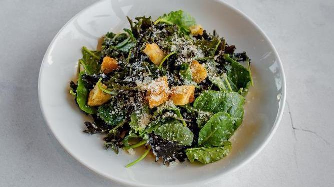 Kale Caesar Salad · Baby Kale, Caesar Dressing, Sourdough Croutons, Parmigiano Reggiano.