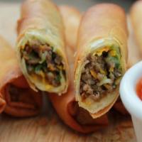 Spring Rolls · Beef spring rolls with shaved mozzarella cheese and creamy horseradish