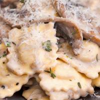 Truffle Mushroom Ravioli · Portobello mushroom, ricotta cheese, parmesan cheese, toasted almonds and truffle mushroom p...