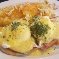 Eggs Benedict · Lumpy's signature eggs benedict... grilled English muffin, topped with ham, poached eggs and...