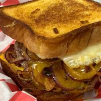 Lumpy’s Stubb · 1/3lb burger patty on grilled Texas Toast, topped with melted Swiss and American cheese, cri...