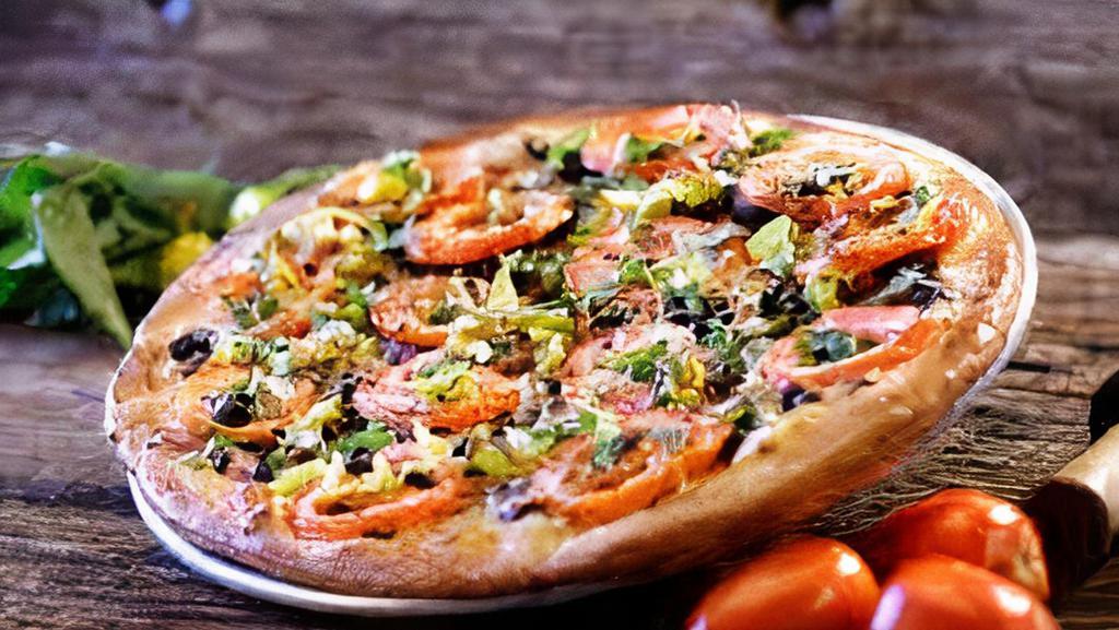 Peace In The Middle East Pizza · Homemade hummus, vine ripe tomatoes, kalamata olives, caramelized onions, feta, fresh basil, pepperoncini and mozzarella.