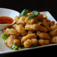 Salt and Pepper · Deep-fried with scallions, jalapeños, white pepper and five spice, served with a sweet and s...