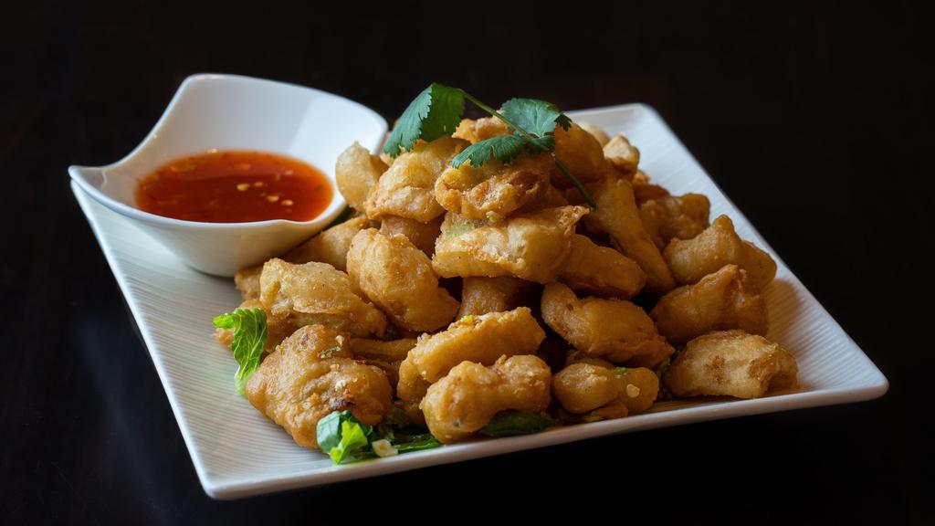 Salt and Pepper · Deep-fried with scallions, jalapeños, white pepper and five spice, served with a sweet and sour chili sauce.