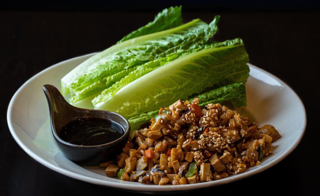 Lettuce Wrap Chicken · Romaine lettuce with carrots, green bell peppers, mushrooms, radish, ginger, garlic, water chestnuts, sesame seeds and hoisin sauce. GFS.
