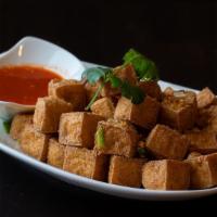 Fried Tofu · Deep fried soft tofu. Tossed with house seasoning and jalapeno. Served with a sweet and sour...