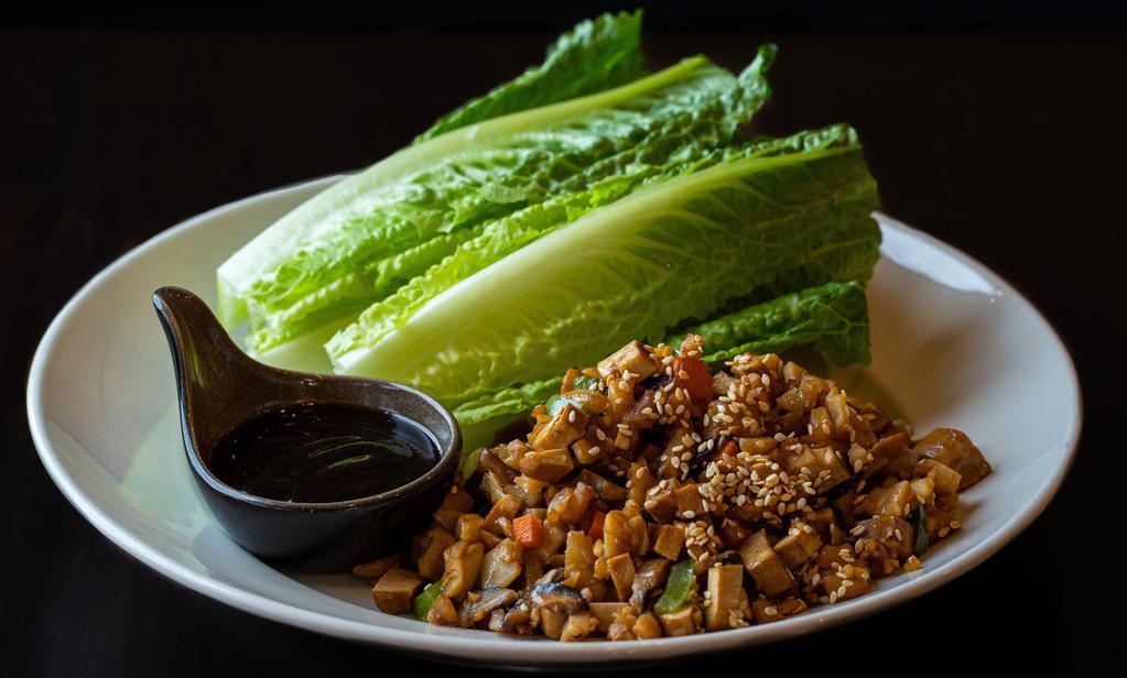 Lettuce Wrap Tofu · Romaine lettuce with carrots, green bell peppers, mushrooms, radish, ginger, garlic, water chestnuts, sesame seeds and hoisin sauce. GFS.