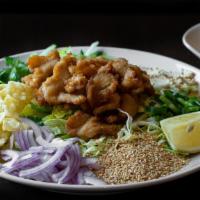 Burmese Chicken Salad · Bite-sized fried chicken with red onions, yellow bean powder, cabbage, cilantro, fried wonto...