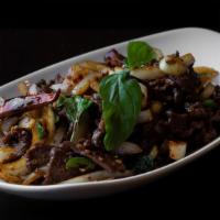 Basil and Dried Chili Beef · Marinated tri tip tossed with dried red chili flakes, Thai chilies, jalapeños, onions, tamar...
