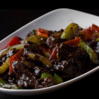 Black Pepper Beef · Marinated beef with onions, red and green bell peppers, carrots, ginger, garlic, scallions, ...
