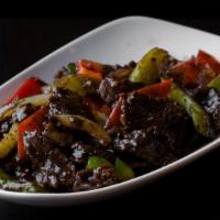 Black Pepper Lamb · Marinated lamb with onions, red and green bell peppers, carrots, ginger, garlic scallions, w...