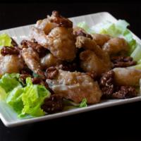 Walnut Shrimp · Lightly fried shrimp tossed in a wok with sweet sauce, topped with toasted walnuts and sesam...