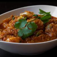Shrimp Curry · Gluten-free. Shrimp, onions, cilantro, jalapeños, garlic, ginger, paprika, masala, turmeric ...