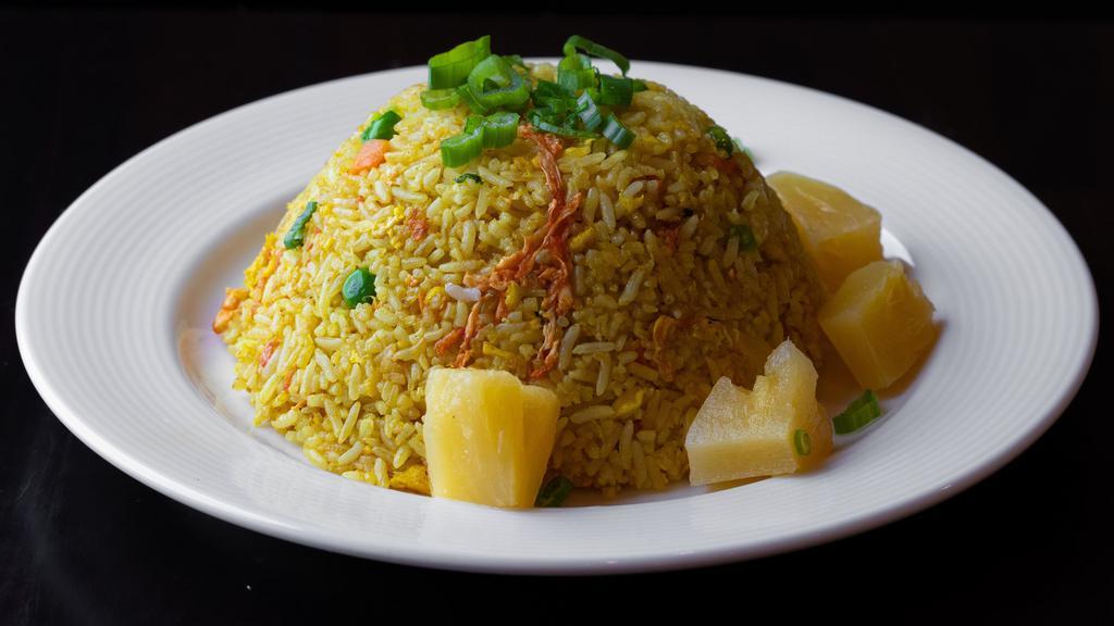 Pineapple Fried Rice · Gluten-free. Choice of jasmine or brown rice with pineapple, green beans, carrots, egg, onions, scallions, soy sauce and turmeric.