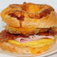 Ultimate Breakfast Bagel · Includes three meats
Sausage 
Bacon 
Ham
Cheddar Cheese and Egg
