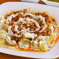 Mantu · Similar to dumplings,but with ground seasoned beef,onion, dry mint and toped with ground bee...