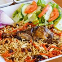 Quabili Pallow Plate · Basmati brown rice with seasoned lamb cooked in the oven and topped with raisins, carrots, a...