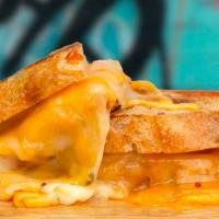 Jalapeno Cheddar Grilled Cheese · Melted cheddar and pepper jack cheese, spicy jalapenos, and mayo between two slices of butte...
