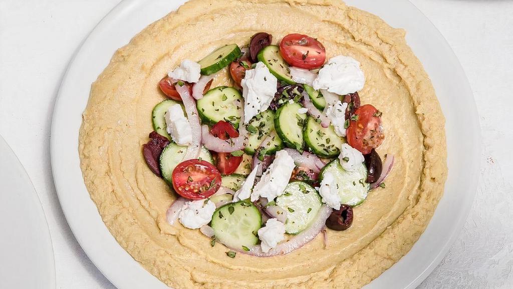 Herb Hummus, Veg · cucumber, cherry tomato, onion, olive, feta, lemon oregano vinaigrette & house-made pita VEG.