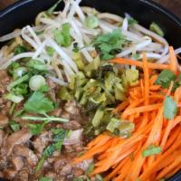 Braised Pork Noodle · Our signature braised pork with carrots, bean sprouts, mustard greens, and cilantro. Mix tog...