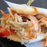 Fried Chicken Bao · Succulent fried chicken with pickled vegetables and chili aioli