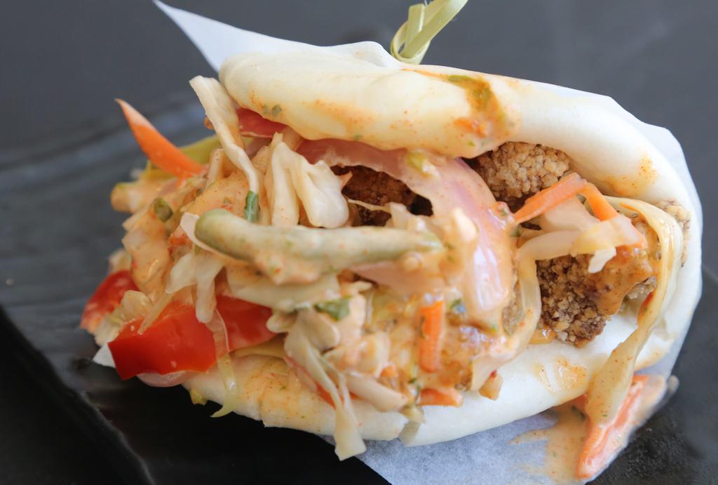 Fried Chicken Bao · Succulent fried chicken with pickled vegetables and chili aioli