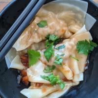 Handmade Shrimp & Pork Wontons · Non-spicy with house sauce and topped with cilantro and green onion. 8 pieces per order.