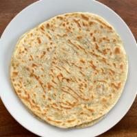 Coconut Titiyas (2) · Traditional flatbread made with green onion and coconut milk. A delicious addition to any di...