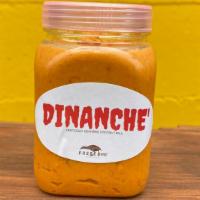 Jar of Dinanche Hot Sauce (6oz) · A classic pepper paste made with hot peppers, eggplant, coconut milk and soy sauce. Not just...