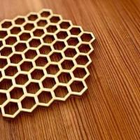 Laser Cut Honeycomb Wood Coasters · These coasters are just under 4” in diameter and 1/8” thick. They’re made from Baltic birch ...