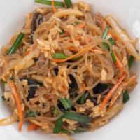 Japchae Bap (vv) · Vegan. Vermicelli, white rice, onion, carrot, garlic chive, wood ear mushroom. 
Contains soy...