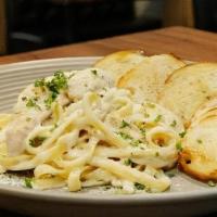 Chicken Alfredo Pasta · House-made Creamy Alfredo Sauce, Fettuccine Pasta, and Parmesan Cheese with Chicken.