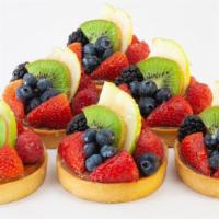 Fruit Tart · Buttery crust, frangipan, fresh fruits, chocolate decor and clear glace.