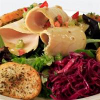 Chicken Breast Salad · Marinated and shredded chicken breast on spring mix,
celery roots and diced tomato & vegetab...