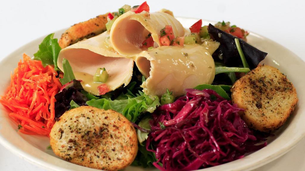 Chicken Breast Salad · Marinated and shredded chicken breast on spring mix,
celery roots and diced tomato & vegetables, house
lemon dressing and sliced house baguette.