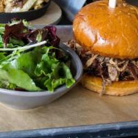 Pulled Pork Sandwich · House Smoked Pulled Pork. Topped w/ Crispy Fried Shallot Onions, Served w/ Java BBQ on a Bur...