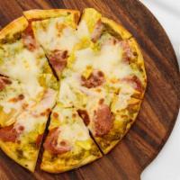 Pineapple Pepperoni Pizza · A delicious combo of pepperoni, fresh cut pineapple, cilantro-jalapeno pesto and mozzarella....