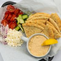 Hummus Platter · Our delicious home made hummus with tomatoes, cucumbers, red onions, feta and warm pita bread.