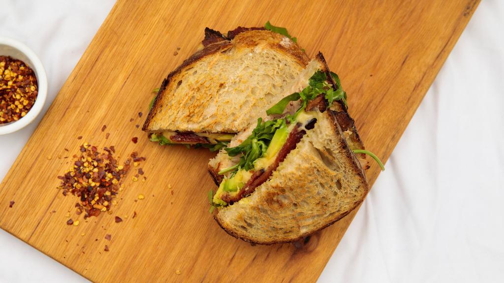 Turkey, Avocado and Bacon · This is our most popular sandwich. turkey breast with avocado, melted gouda and thick cut crispy smoked bacon on delicious multigrain miche bread.
