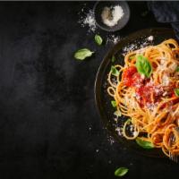 Spaghetti with Bolognese · Hearty bolognese sauce prepared with minced meat, fresh tomatoes, mushrooms, and onions serv...