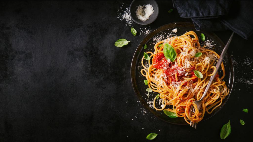 Spaghetti with Bolognese · Hearty bolognese sauce prepared with minced meat, fresh tomatoes, mushrooms, and onions served over spaghetti pasta.