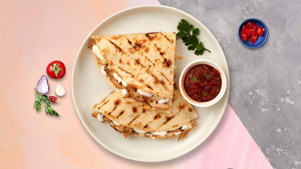 Super Quesadilla · Melted cheese, sour cream, lettuce, tomato, salsa and your choice of meat.