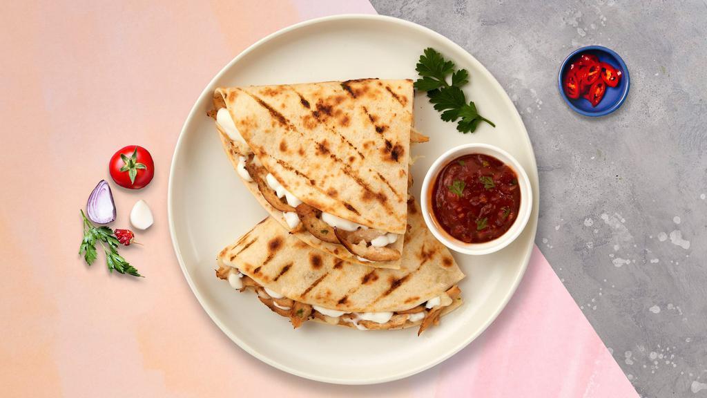 Eve's Veggie Quesadilla · Mix of veggies with cheese and salsa. Upgrade your quesadilla by adding cheese, guacamole, sour cream, lettuce, and tomato.