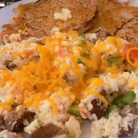 Italian Omelet · Grilled and sliced Italian sausage, sautéed, tomatoes, green peppers and onions with cheddar...